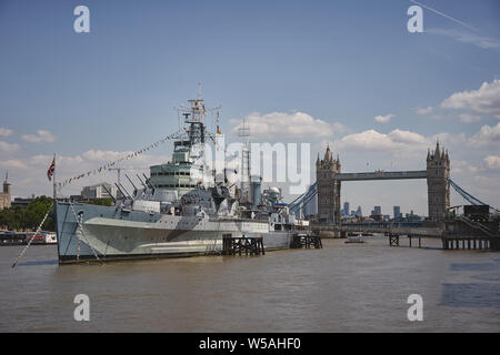 London, UK - July, 2019. View of the HMS Belfast with the Tower Bridge on the background. Stock Photo