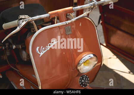 London, UK - July, 2019. Details of a Piaggio Vespa scooter. Stock Photo