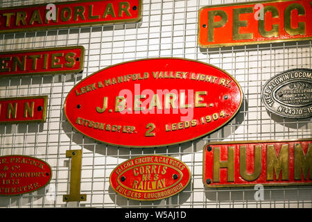 A display of steam engine nameplates in the Narrow Gauge Railway Museum based at Tywyn Wharf station on the Talyllyn Railway, Gwynedd, Wales, UK Stock Photo