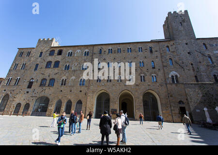 San Gimignano, Italy - April 12, 2015: historic building in san gimignano in tuscany, Italy. Tourists are walking around taking picture Stock Photo