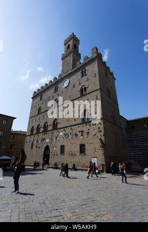 San Gimignano, Italy - April 11, 2015: historic building in san gimignano in tuscany, Italy. Tourists are walking around taking picture Stock Photo