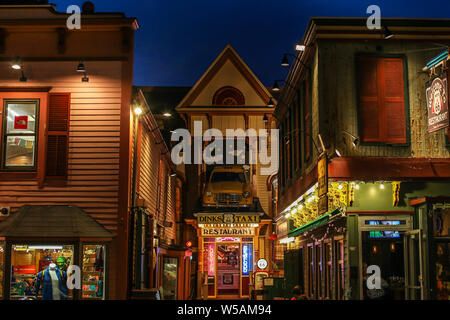BAR HARBOR, MAINE, USA - JULY11, 2013: Evening lights and building facade from 'Route US 66'restaurant on Cottage Street. Stock Photo