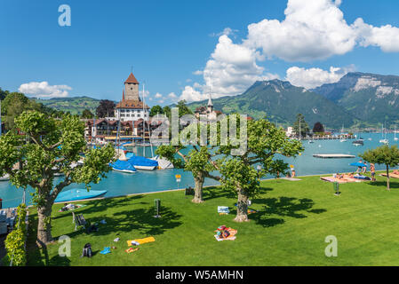 View over the open-air swimming pool to Spiez Castle, Spiez, Bernese Oberland, Switzerland, Europe Stock Photo