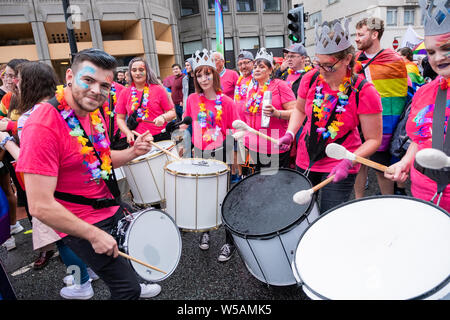 Liverpool, UK. July 27, 2019. Thousands of people, despite the rain, joined a march through Liverpool city centre on Saturday, July 27, 2019 to celebrate LGBT+ and its vibrant community under the slogan, 'Come As You Are'. The event is held annually in commemoration of the death of Michael Causer, a young gay man who was murdered in the city in 2008. Credit: Christopher Middleton/Alamy Live News Stock Photo