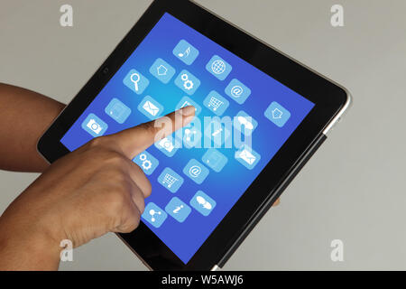 Close up of a person hand using a digital tablet Stock Photo