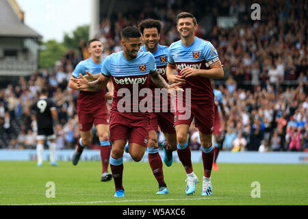 London, UK. 27th July, 2019. Manuel Lanzini of West Ham Utd (m) celebrates with teammates after he scores his teams 1st goal. pre-season football friendly match, Fulham v West Ham United at Craven Cottage in London on Saturday 27th July 2019. this image may only be used for Editorial purposes. Editorial use only, license required for commercial use. No use in betting, games or a single club/league/player publications. pic by Steffan Bowen/Andrew Orchard sports photography/Alamy Live news Credit: Andrew Orchard sports photography/Alamy Live News Stock Photo