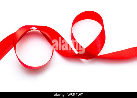 Red curly Ribbon Tape Band top View isolated on white Background Stock Photo