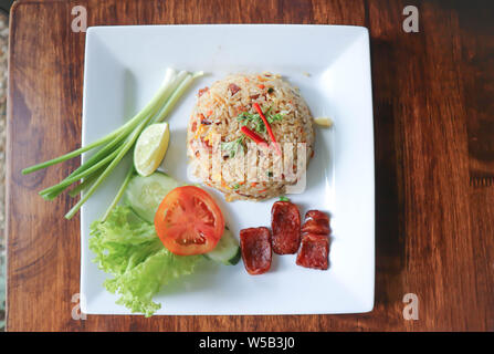 stir-fried rice with deep fried sausage and vegetable Stock Photo
