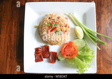 stir-fried rice with deep fried sausage and vegetable Stock Photo