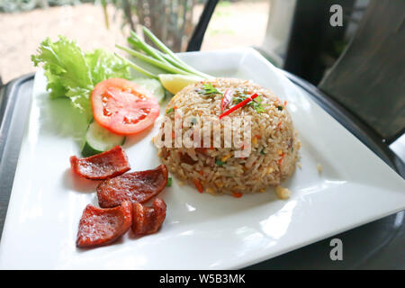 stir-fried rice with deep fried sausage and vegetable Stock Photo
