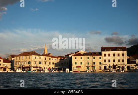 Anchored vessels, boats, ships, sailing boats, etc in Stari grad, Hvar island, Croatia during sunset time. Stock Photo