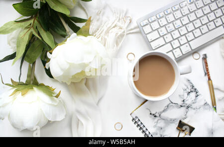 Female workspace on white background Stock Photo