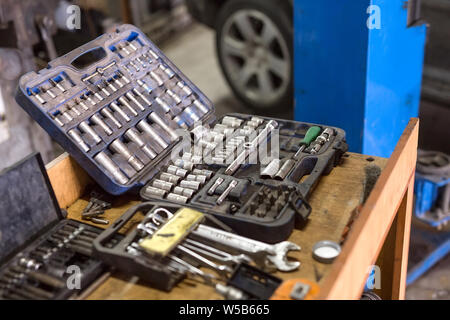 Wrenches for car repairs. Auto mechanic working in garage. Repair service. Stock Photo