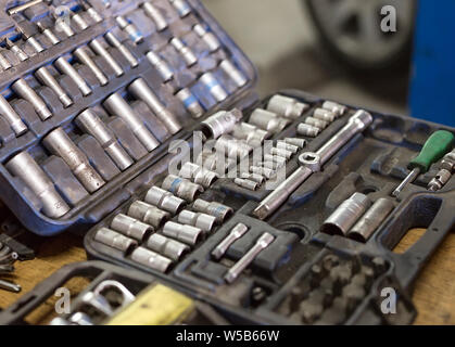 Wrenches for car repairs. Auto mechanic working in garage. Repair service. Stock Photo