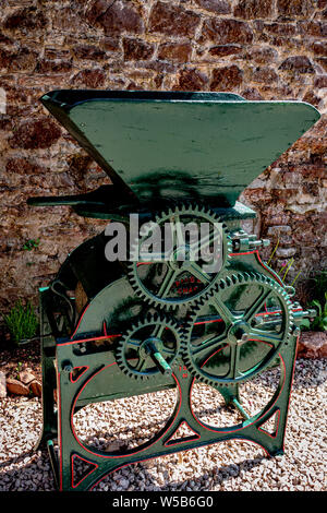 Restored Old Portable Vintage Grain /Wheat Crusher with Wooden Hopper in Devon Village .UK Stock Photo