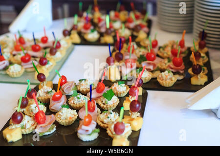 the buffet at the reception. Assortment of canapes Stock Photo