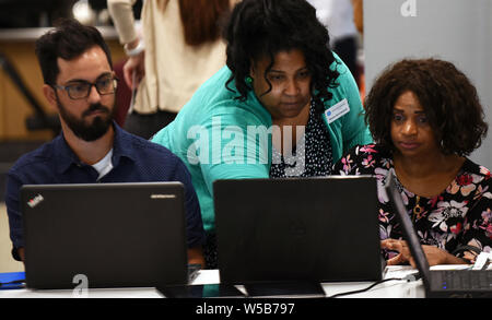 Orlando, United States. 26th July, 2019. Orlando, Florida, USA. 26th July, 2019.  People use computers to apply for jobs at the OrlandoJobs.com Job Fair at the Amway Center on July 26, 2016 in OrIando, Florida. Credit: Paul Hennessy/Alamy Live News Stock Photo