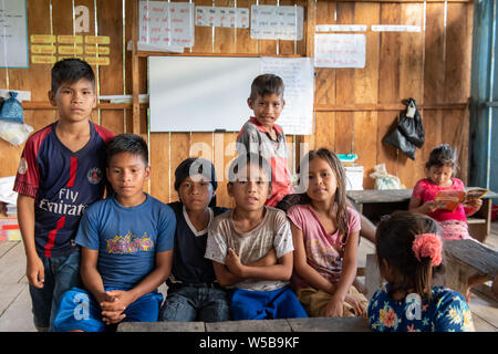 Warmi Isla Village and their Schoolhouse on the Peruvian Amazon Stock Photo