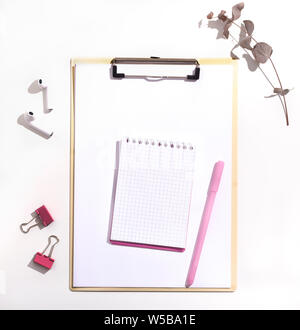 Notepad with blank space and pink pen on white background Stock Photo