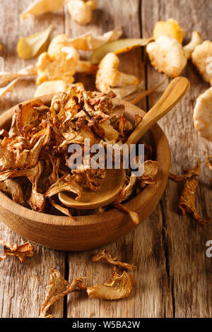 Dried fragrant chanterelle mushrooms close-up on a plate on the table. vertical Stock Photo