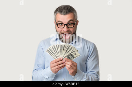 Super happy bearded caucasian man holding money Stock Photo