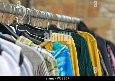 used cloting on a rail Stock Photo