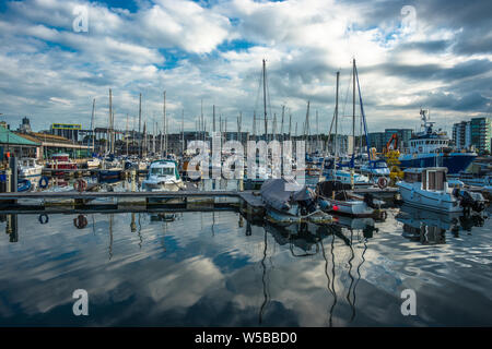 Sutton Harbour, formerly known as Sutton Pool, is the original port of the City of Plymouth the historic Barbican district in Devon, England. UK. Stock Photo