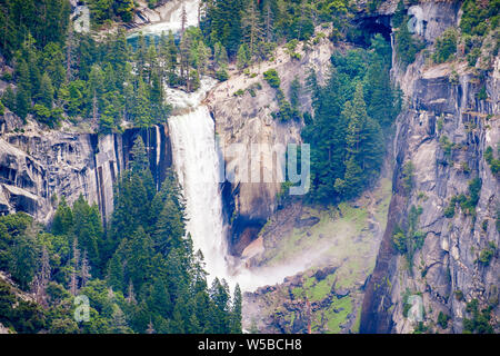Aerial view of Vernal Fall and Emerald Pool, Yosemite National Park, Sierra Nevada mountains, California; People gathered above the waterfall or walki Stock Photo