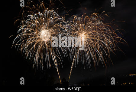 Abstract colored firework against a black background with free space for text Stock Photo