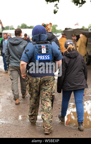 War and Peace Revival 2019, Paddock Wood Hop Farm. Member of the public dressed up as press. Stock Photo