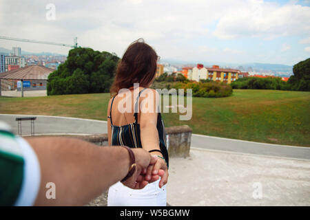 Woman holding her boyfriend's hand. Stock Photo