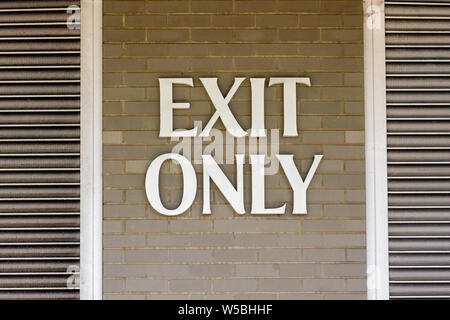 Exit only sign large on a wall Stock Photo