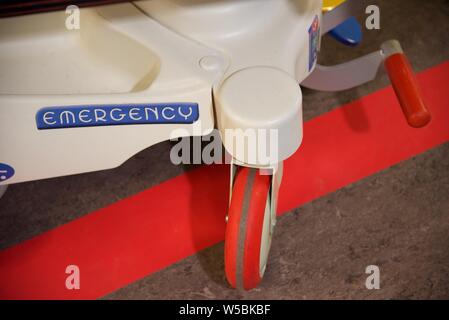 Arras, Hautes-de-France/France-March 10 2019: close up of a hospital gurney wheel assembly on the linoleum flooring of a corridor Stock Photo