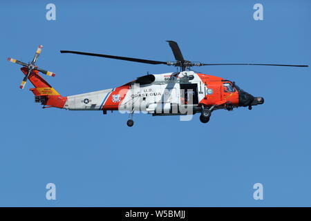 United States Coast Guard Rescue helicopter flying during the Great Pacific Airshow in Huntington Beach, California on October 19, 2018 Stock Photo