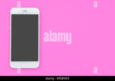 Smartphone on pink background with copy space and clipping path. Flat lay. Top view. Stock Photo