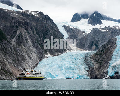 Exploring the Northwestern Glacier on board the National Geographic Orion in Kenai Fjords National Park, Alaska, USA Stock Photo