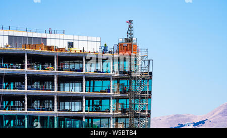 July 19, 2019 Sunnyvale / CA / USA - Detail of modern office building under construction; visible steel frame and metal stairs; Silicon Valley, South Stock Photo