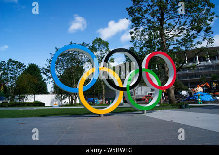 Tokyo, Japan. Olympic rings in front of the new national stadium of Tokyo in representation of the 2020 olympics.