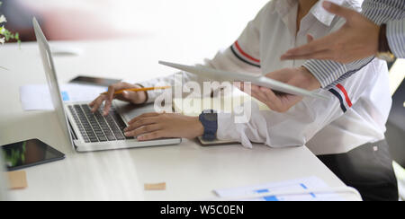 UI UX website development team sketching wireframe layout for responsive web content in studio Stock Photo