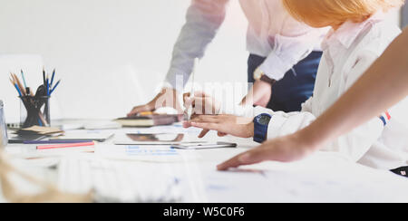 UI UX website development team sketching wireframe layout for responsive web content in studio Stock Photo
