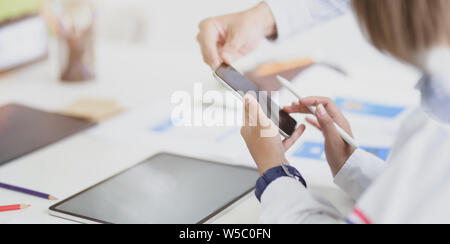 A group of young developer discussing their ideas in office room Stock Photo