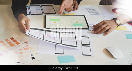 UX Graphic designer creative planning application process and development prototype wireframe for web or mobile smart phone Stock Photo