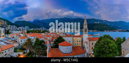 Sunset aerial view of Budva Old Town from the Citadel with the Holy Trinity church and Adriatic Sea in the background in Montenegro, Balkans Stock Photo