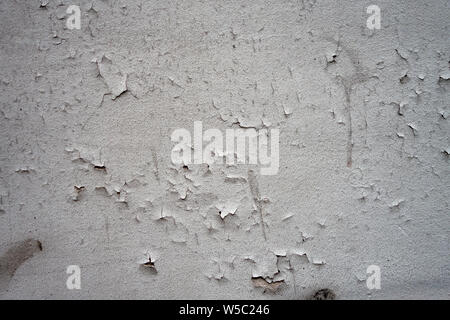 cracking paint on a white wall surface background Stock Photo