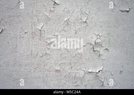 cracking paint on a white wall surface background Stock Photo