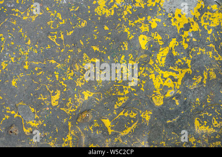 chipped yellow painted concrete floor Stock Photo