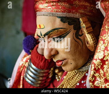 Munnar, India, Mar 11, 2018 - Traditional Indian dancer adjusts his costume prior to show Stock Photo