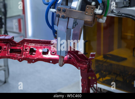 Automated robotic arm spot welding in automotive industry Stock Photo