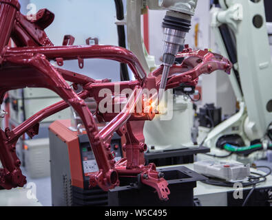Automated robotic arm welding in automotive industry Stock Photo