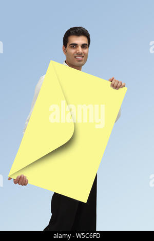 Man with big envelope in hand Stock Photo